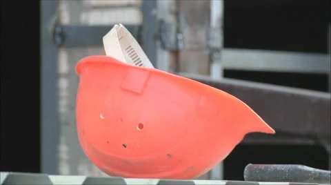 Construction helmet swinging in the wind Stock Footage 9380537