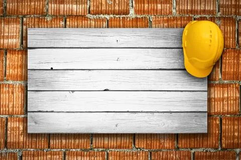 Construction helmet on the wall Stock Photos