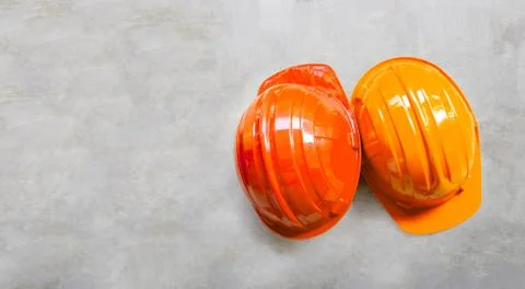 Construction helmets on concrete background. Stock Photos