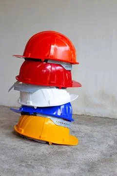 Construction helmets on concrete background. Stock Photos