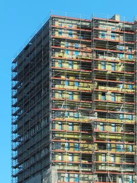 Construction of a high multi-storey building. Skyscraper furnished with metal Stock Photos