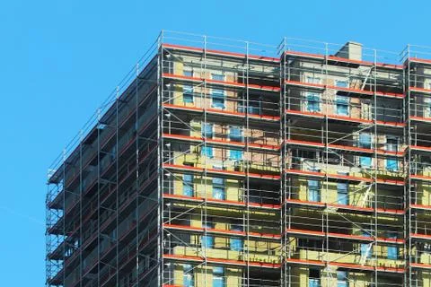 Construction of a high multi-storey building. Skyscraper furnished with metal Stock Photos