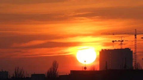 Construction of a high-rise building on a sunset background. Construction site 動画素材 121010578