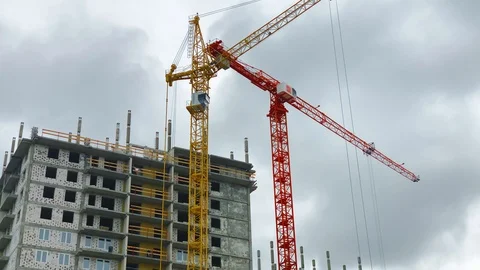 Construction of a high-rise building. Two cranes on the background of the buildi Video stock 108737514