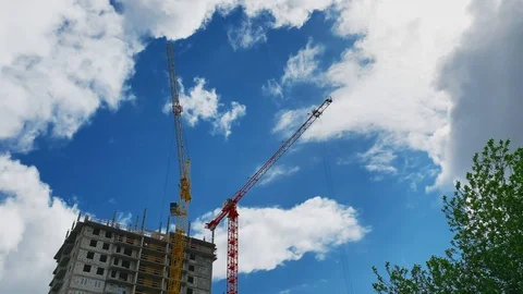 Construction of a high-rise building. Two cranes on the background of the buildi 스톡 동영상 108738254