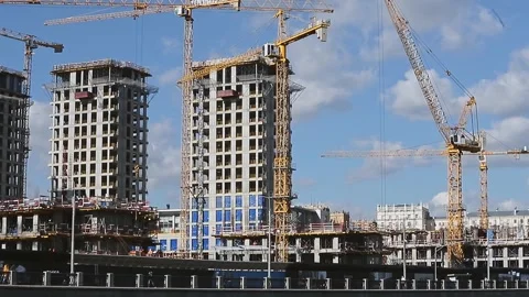 Construction of high-rise buildings with high-rise cranes Stock Footage 307629734