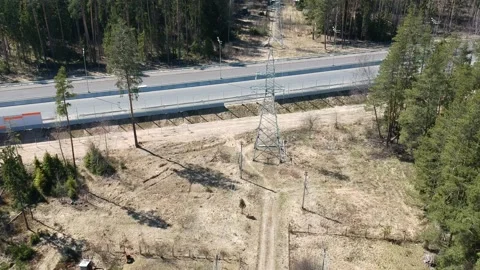 Construction of a high speed highway in the forest. Aerial video from drone Stock Footage 144358306
