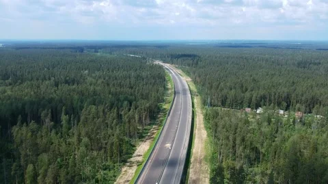 Construction of a high speed highway in the forest. Aerial video from drone Stock Footage 149424230