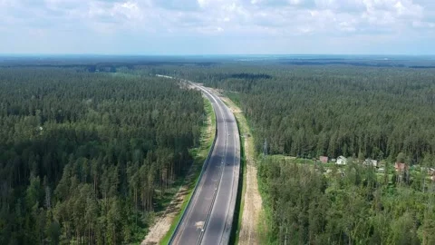 Construction of a high speed highway in the forest. Aerial video from above from Stock Footage 160537710