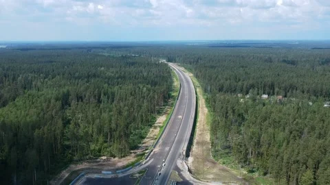 Construction of a high speed highway in the forest. Aerial video from drone 스톡 동영상 161355209