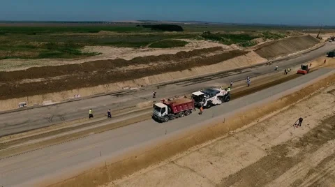 Construction of highways . Road construction machinery . Aerial view Stock Footage 64907803
