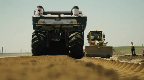 Construction of highways . Road construction machinery . Aerial view Stock Footage 64931384