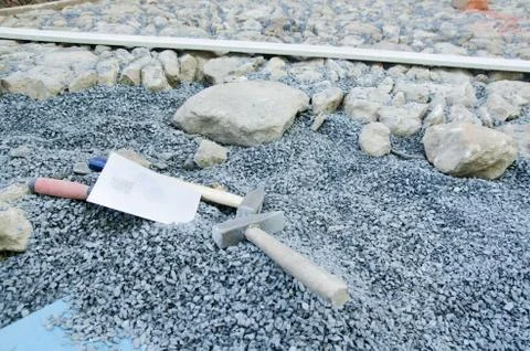 Construction of historic looking cobblestone pavement on the yard Stock Photos