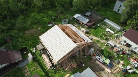 Construction of a house in the forest with a drone Stock Footage 236356572