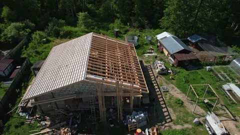 Construction of a house in the forest with a drone Stock Footage 236356665