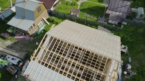 Construction of a house in the forest with a drone Stock Footage 236356670