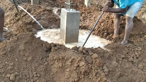 Construction of House -Foundation level-Watering to the columns -HD 4K video Stock Footage 242092915