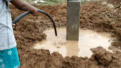 Construction of House -Foundation level-Watering to the columns -HD 4K video 库存影片 242092917