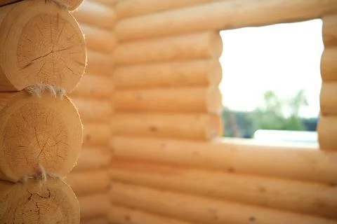 Construction of a house from rounded logs. Ecological house. Stock Photos