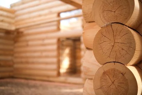 Construction of a house from rounded logs. Ecological house. Stock Photos