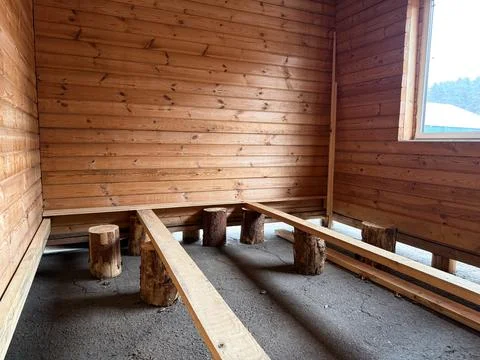 Construction of a house from rounded logs. Ecological house. Stock Photos