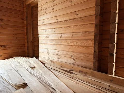 Construction of a house from rounded logs. Ecological house. Stock Photos