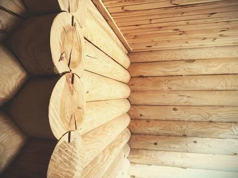 Construction of a house from rounded logs. Ecological house. Stock Photos
