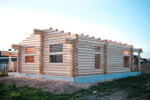 Construction of a house from rounded logs Stock Photos