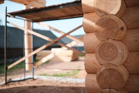 Construction of a house from rounded logs Stock Photos