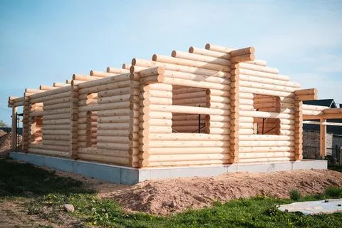 Construction of a house from rounded logs Stock Photos