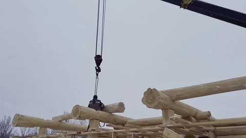 Construction of a house from solid logs. Slow motion video. Video stock 303359274