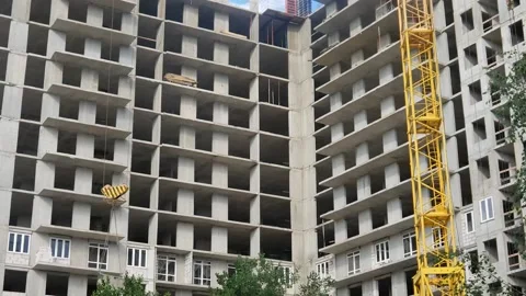 Construction of a house with a tower crane. Bottom view. Stock Footage 135838073
