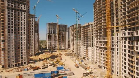 Construction of houses. Drone fly over construction site with tower cranes Stock Footage 91584067
