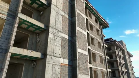 Construction of houses, the process of preparing the facade for cladding Aerial Stock Footage 231189258