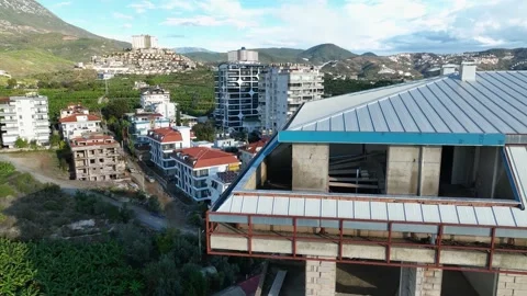 Construction of houses, the process of preparing the facade for cladding Aerial Stock Footage 231189328