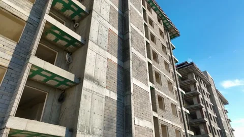 Construction of houses, the process of preparing the facade for cladding Aerial Stock Footage 231189387