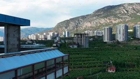 Construction of houses, the process of preparing the facade for cladding Aerial Stock Footage 231189660