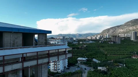 Construction of houses, the process of preparing the facade for cladding Aerial Stock Footage 231190301