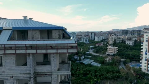Construction of houses, the process of preparing the facade for cladding Aerial Stock Footage 231190397
