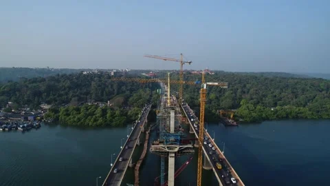 Construction of a huge bridge over the river. Aerial view. Stock-Footage 85527801