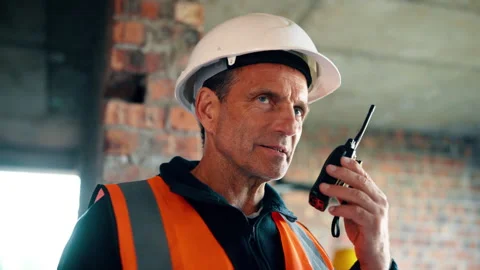 Construction, idea and radio with man on building site for planning, property Stock Footage 336209388
