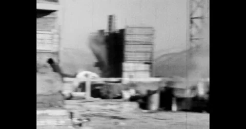 Construction of an industrial facility among the mountains. Man gives a signal Vídeo Stock 246786228