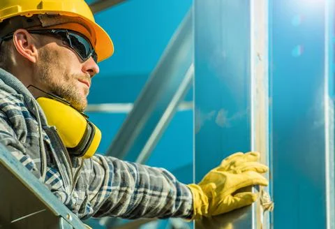 Construction Industry Contractor Worker Staying Next to Aluminium Building Fr Stock Photos