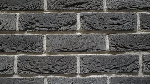 Construction industry, gray brick wall, building material Stock Photos