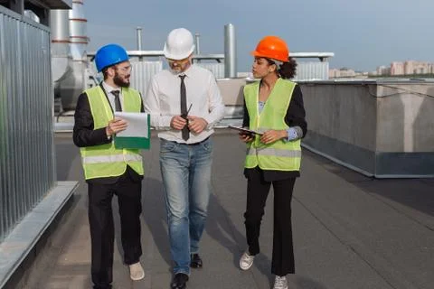 Construction industry group of engineer and architect analyzing the plan of Stock Photos