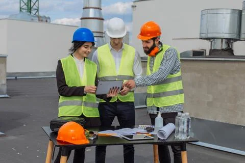 Construction industry group of engineer and architect analyzing the plan of Stock Photos