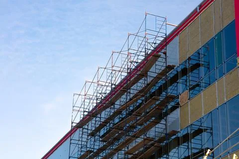 Construction industry scaffolding structure skyscraper building site Stock Photos