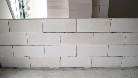 The construction of the interior wall of the room from blocks. Construction o Stock Photos