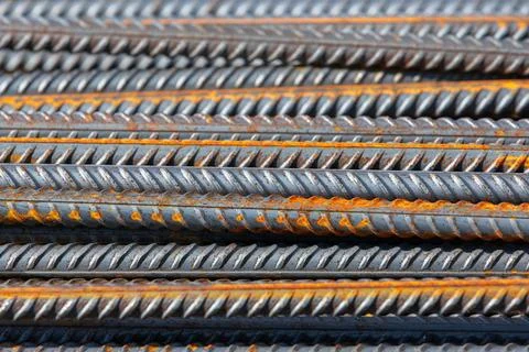Construction iron rods with rust spots, abstract industrial background Stock Photos