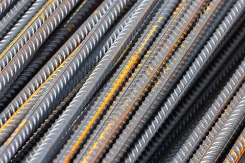 Construction iron rods with rust spots, abstract industrial background Stock Photos